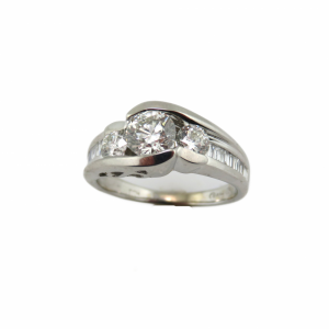 3 round diamond center stones with baguette diamonds down the sides in white gold