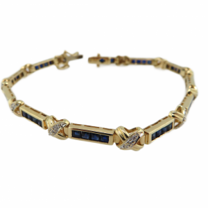 Princess cut Sapphires and Diamond tennis bracelet in 14kt  yellow gold
