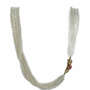 4 strands of seed pearls with a decorative hidden clasp with Rubies